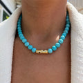 Turquoise beaded gold rod eye necklace