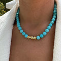 Turquoise beaded gold rod eye necklace